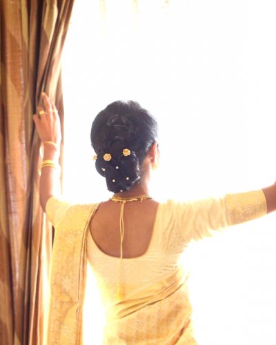 Beautiful bridal hair updo with pearls - feathertouch beauty salon, pathanamthitta