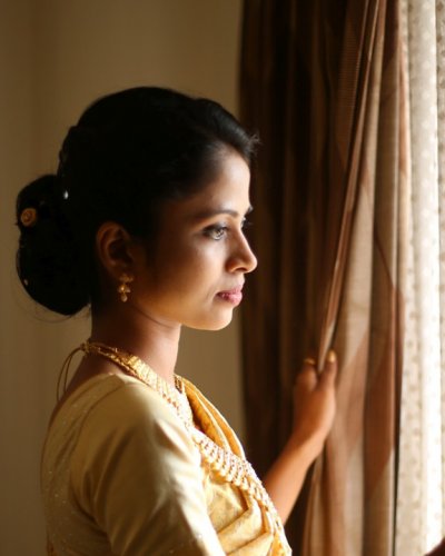 Adorable bride in golden saree - feathertouch beauty parlour, pathanamthitta